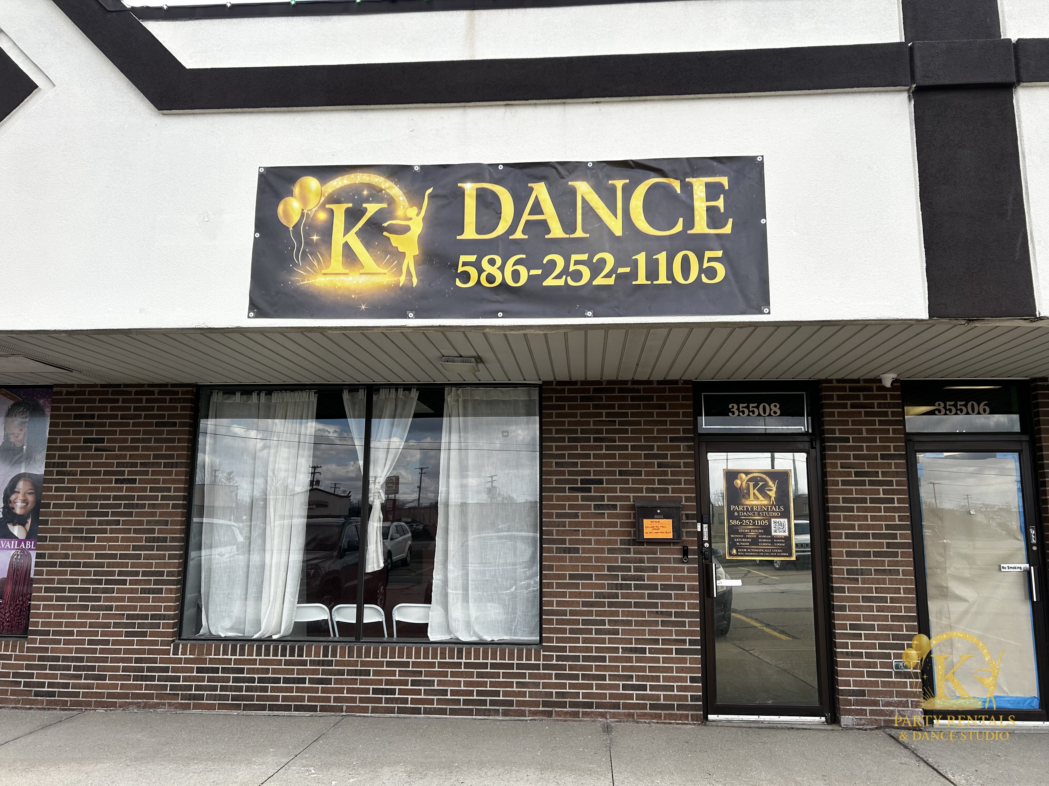 Interior of K Party Rentals & Dance Studio with lit mirror wall and gold logo